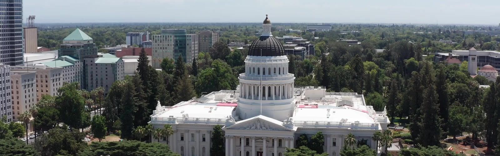 Close-up panning aerial shot of the California State Capitol in Sacramento at daytime. 4K